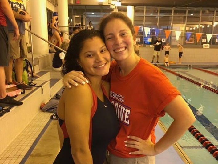 Mercury staff writer Mya Guardino stands with Girls Varsity Swim Coach Nikki Brady