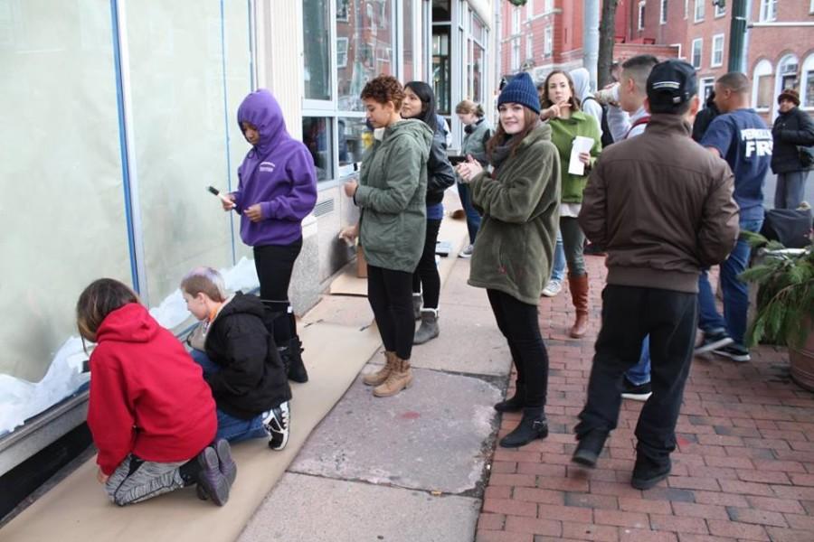 PCSD students paint windows in downtown Peekskill 