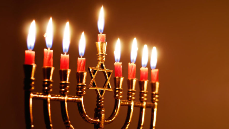 Candles lit for the eighth night of Hanukkah
